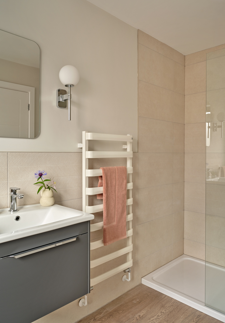 Neutral modern ensuite bathroom in grey and soft coral colours